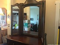 Front view of triple mirror on dresser