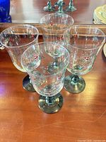 Group of holly motif stem glasses showing style and quantity