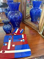 Large and small cobalt blue vases with fused art glass plates