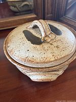 Covered serving dish, tan speckled glaze, crack visible on lid