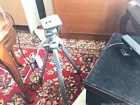 Full view of Focal aluminum tripod standing on carpet