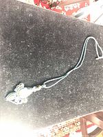 Full view of necklace showing cord length and pendant