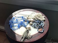 All necklaces grouped on round surface