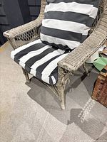 Front view of wicker armchair with striped cushions