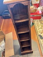 Front view of brown wooden 5-cubby shelf
