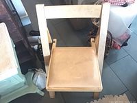 Front view of the wood chair showing seat and frame