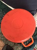 Underside base showing orange enamel and size
