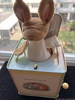 Jack-in-the-box open showing plush hare