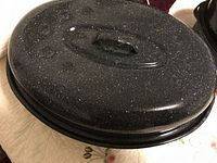 Black speckled enamel oval roasting pan with lid