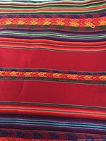 Overall view of runner showing red base and multicoloured stripes
