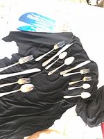 All pieces laid out on black fabric showing quantity and handle pattern