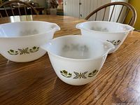 Three Meadow Green bowls upright showing pattern