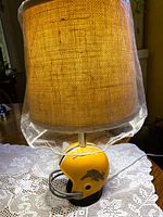 Lamp full view showing helmet base and shade