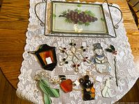 overview showing tray and nine suncatchers on lace cloth