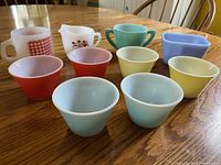 Group shot of all ten milk glass pieces on table