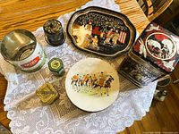 Overview of all tins on lace mat