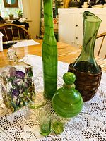 Group shot showing all seven green glass pieces