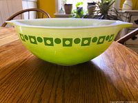 Side profile showing green exterior and geometric band