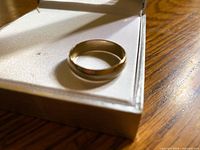 Ring in box showing overall exterior and shape