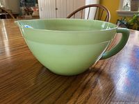 Side view of jadeite batter bowl showing handle and overall shape
