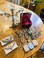 Overview of all jewelry, stand and box on table