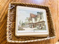stack of placemats inside wicker basket