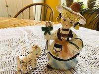 Full front view of figurine showing Mary and lamb