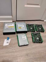 Group view of all six drives—three Seagate HDDs and three Samsung DVD drives with green rails
