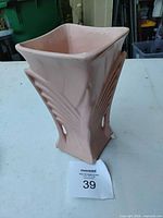 Front angled view of pink McCoy vase showing ribbed sides and square rim