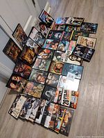 Full assortment of DVD cases laid out on floor
