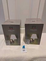 Front view of both boxed wall sconces