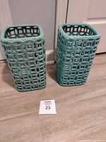 Both turquoise ceramic square openwork accents front view