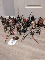 Group shot of entire lot showing quantity and variety of knights, horses and accessories.