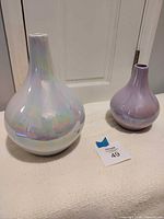 Both vases side by side showing size difference and finish