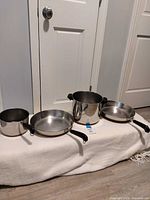 Four Revere Ware pans lined up showing form factors