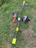 All three tools laid out on grass