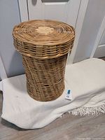 Closed rattan hamper front view