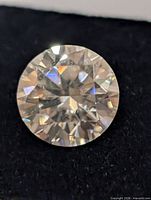 Front view of round brilliant moissanite showing facets