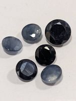 Close-up of loose round faceted blue sapphire gemstone(s)