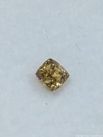 Close-up of the loose cushion-cut diamond