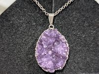 Front view of purple druzy pendant on chain