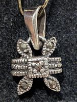 Front view of silver marcasite pendant showing stone arrangement