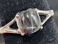 Front view of sterling ring with star diopside cabochon