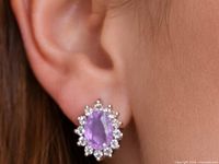 Earring worn on ear showing size and design