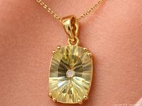 front view of silver lemon quartz pendant on chain