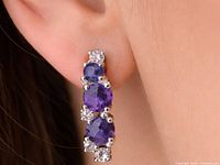 Earring worn, showing size and arrangement of amethysts and clear stones