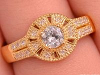 Top view of ring showing center white topaz and surrounding CZ