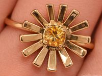 Top view of citrine ring showing sunburst design and stone setting