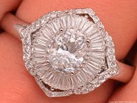 Frontal view of silver CZ ring showing stone arrangement and halo details