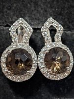 Front view showing smokey quartz centres and CZ halos